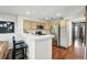 Efficient kitchen with stainless steel appliances and open breakfast bar at 4878 E Kentucky Ave # B, Denver, CO 80246