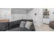 Relaxing living room area with plush seating and a cozy atmosphere near white doors and bookcase at 10152 Xanadu St, Commerce City, CO 80022
