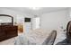 Bright main bedroom boasts an ensuite bathroom and flat screen television for relaxing convenience at 10152 Xanadu St, Commerce City, CO 80022
