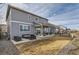 The backyard has a covered patio with seating, a grill, and a well-maintained lawn at 4724 S Wenatchee Cir, Aurora, CO 80015