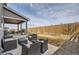 This backyard features a covered patio with outdoor seating and a gas grill at 4724 S Wenatchee Cir, Aurora, CO 80015