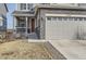Charming two story home with stone accents, attached two-car garage, and welcoming front porch at 4724 S Wenatchee Cir, Aurora, CO 80015