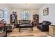 Comfortable living room with a large window, hardwood floors, and stylish furniture at 4724 S Wenatchee Cir, Aurora, CO 80015