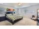 Bedroom with a large bed, white walls, and a large window that provides plenty of natural light at 4724 S Wenatchee Cir, Aurora, CO 80015
