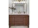 Beautiful bathroom vanity with wood detail, gold fixtures, modern sink, and a mirror at 1210 E Colfax Ave # 104, Denver, CO 80218