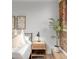 Close up of bedside table and exposed brick accent wall at 1210 E Colfax Ave # 104, Denver, CO 80218