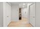 Bright hallway with modern flooring and crisp white doors, leading to a charming interior at 1210 E Colfax Ave # 104, Denver, CO 80218