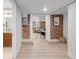 Bright hallway showcasing an open layout and hardwood flooring leading to living space at 1210 E Colfax Ave # 104, Denver, CO 80218