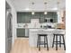Bright, updated kitchen features stainless appliances, pendant lighting, breakfast bar at 1210 E Colfax Ave # 104, Denver, CO 80218