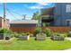 The charming backyard features raised garden beds, lush lawn, and a wood fence for privacy at 771 24Th St, Denver, CO 80205