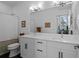 Bright bathroom with double vanity, expansive mirror, and modern fixtures at 771 24Th St, Denver, CO 80205