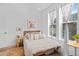 Cozy bedroom with natural light from two windows and a comfortable setting, accented by light colors at 771 24Th St, Denver, CO 80205