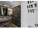 Walk-in closet with ample storage space, shelving, and rods for clothes and shoes at 771 24Th St, Denver, CO 80205