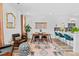 Stylish living and dining area featuring modern decor, hardwood floors, and an open layout to the kitchen at 771 24Th St, Denver, CO 80205