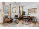 Cozy living area with stylish decor, large windows, hardwood floors, and an open layout to the kitchen at 771 24Th St, Denver, CO 80205