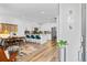 Bright and airy living space with modern finishes, a dining area, and an open kitchen with a large island at 771 24Th St, Denver, CO 80205