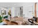 Open-concept living space combining the kitchen, living, and dining areas with hardwood floors and modern finishes at 771 24Th St, Denver, CO 80205
