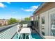 Rooftop deck offers city views and features a built-in outdoor kitchen and dining at 771 24Th St, Denver, CO 80205