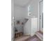 Bright stairway featuring hardwood steps and white walls enhanced with decorative art at 771 24Th St, Denver, CO 80205