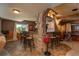 Basement wet bar with granite countertops and stone accents at 3891 Windchant Cir, Castle Rock, CO 80104