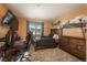 Bedroom with a large window, a bed, and a workspace at 3891 Windchant Cir, Castle Rock, CO 80104