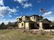 Two-story house with a three-car garage and American flag at 3891 Windchant Cir, Castle Rock, CO 80104