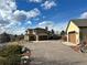 House with a three-car garage and a long driveway at 3891 Windchant Cir, Castle Rock, CO 80104