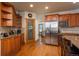 Kitchen with stainless steel appliances and wood cabinets at 3891 Windchant Cir, Castle Rock, CO 80104