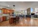 Open kitchen with island and hardwood floors at 3891 Windchant Cir, Castle Rock, CO 80104