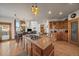 Open kitchen with island and granite countertops at 3891 Windchant Cir, Castle Rock, CO 80104