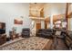 Open living room with high ceilings, hardwood floors, and ample natural light at 3891 Windchant Cir, Castle Rock, CO 80104