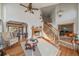 Spacious living room with a fireplace and hardwood floors at 3891 Windchant Cir, Castle Rock, CO 80104