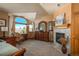 Main bedroom with a fireplace and plenty of natural light at 3891 Windchant Cir, Castle Rock, CO 80104