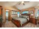 Large main bedroom with access to a luxurious bathroom and great views at 3891 Windchant Cir, Castle Rock, CO 80104