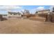 Spacious backyard with ample potential for gardening or recreation, enclosed by a chain-link and wooden fence at 8074 Grove St, Westminster, CO 80031