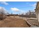 Spacious backyard features a large, enclosed area perfect for pets or recreation at 8074 Grove St, Westminster, CO 80031