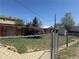 Fenced backyard featuring a well-maintained lawn, shed, and garden, offering privacy and outdoor space at 8074 Grove St, Westminster, CO 80031
