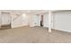 A finished basement area with carpet, neutral walls, and white trim at 8074 Grove St, Westminster, CO 80031