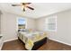 Bedroom features hardwood floors, a ceiling fan and two windows at 8074 Grove St, Westminster, CO 80031