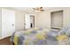 Spacious bedroom with a ceiling fan, hardwood floors, and ample closet space at 8074 Grove St, Westminster, CO 80031