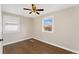 Bedroom with hardwood floors and two windows, providing natural light at 8074 Grove St, Westminster, CO 80031
