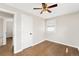 This cozy bedroom features hardwood floors, a ceiling fan, and a bright window at 8074 Grove St, Westminster, CO 80031