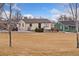 Charming single-story home with a well-manicured front lawn and driveway at 8074 Grove St, Westminster, CO 80031