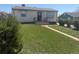 Well-kept front lawn and walkway lead to a charming home, offering great curb appeal at 8074 Grove St, Westminster, CO 80031