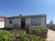 Lovely home with blossoming bushes in the front yard, creating a warm and inviting entrance at 8074 Grove St, Westminster, CO 80031