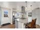 Modern kitchen featuring stainless steel appliances, a granite island, and a bright, airy atmosphere at 8074 Grove St, Westminster, CO 80031