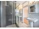 Elegantly designed bathroom showcases a glass-enclosed shower and a stylish pedestal sink at 4225 W 30Th Ave, Denver, CO 80212