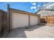 Spacious two car garage with concrete driveway and partial fencing at 4225 W 30Th Ave, Denver, CO 80212
