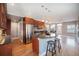 Open kitchen featuring cherry cabinets, granite countertops, and modern stainless steel appliances at 4225 W 30Th Ave, Denver, CO 80212