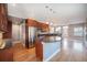 Open kitchen featuring cherry cabinets, granite countertops, and stainless steel appliances at 4225 W 30Th Ave, Denver, CO 80212